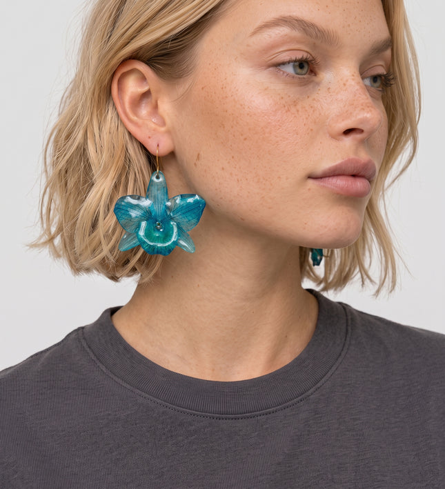Earrings made of real blue Dendrobium nobile orchid in liquid glass