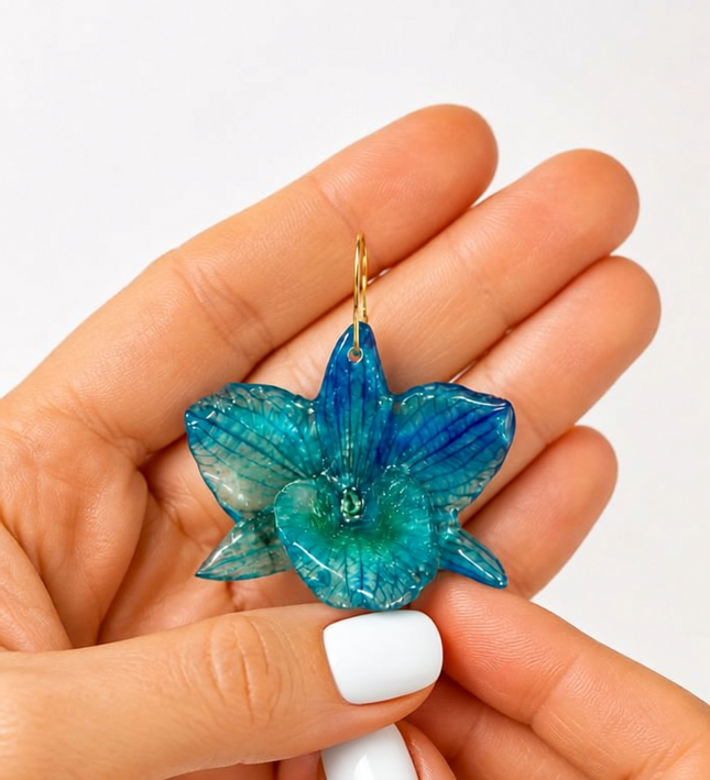 Earrings made of real blue Dendrobium nobile orchid in liquid glass